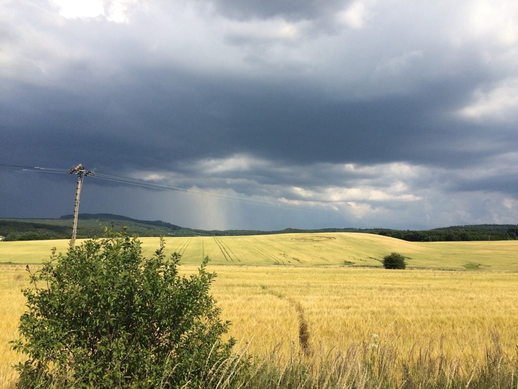 crop circle with storm in the distance